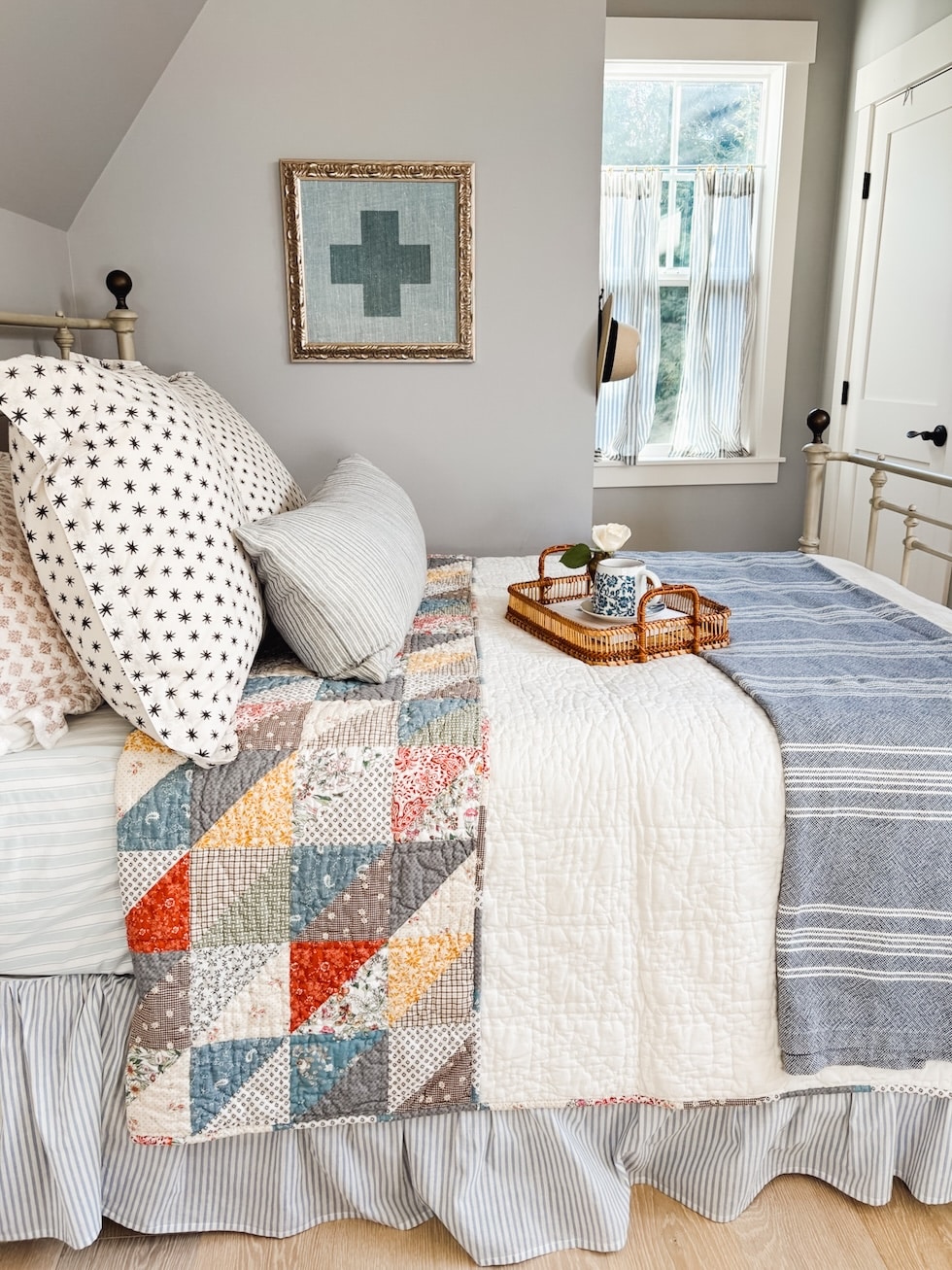 A cozy bed nook under the eaves