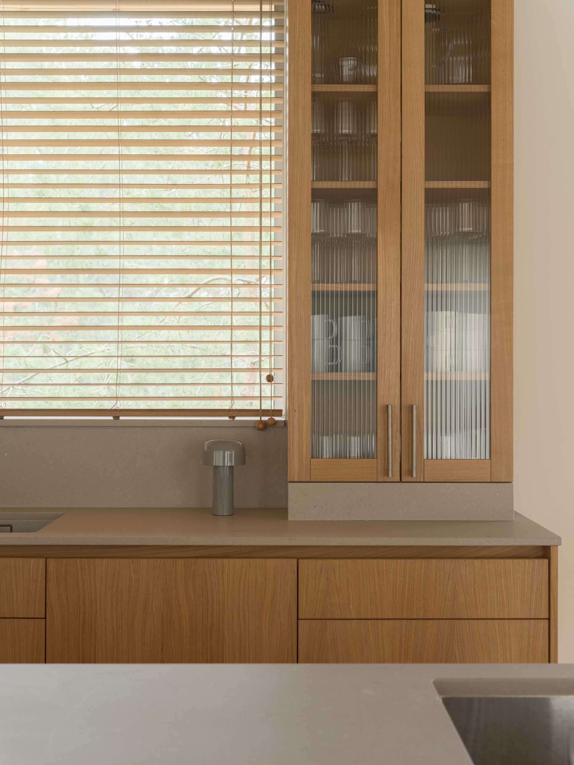 A modern kitchen with wood cabinets.