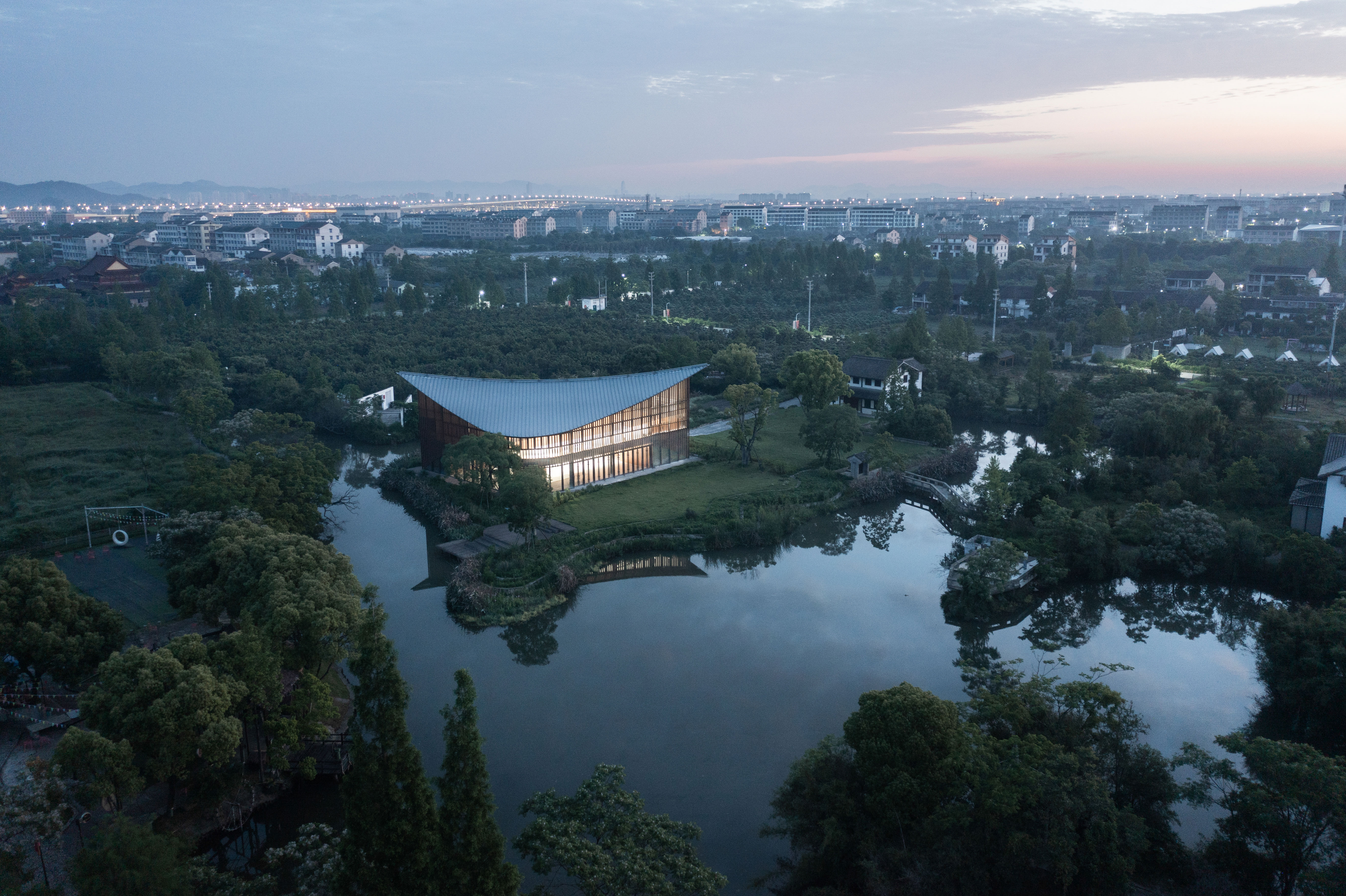 water landscapes, architectural design, urban water features, Chinese architecture, landscape integration, waterfront projects, sustainable design, natural elements in architecture, contemporary architecture, cultural spaces, Liquid landscapes