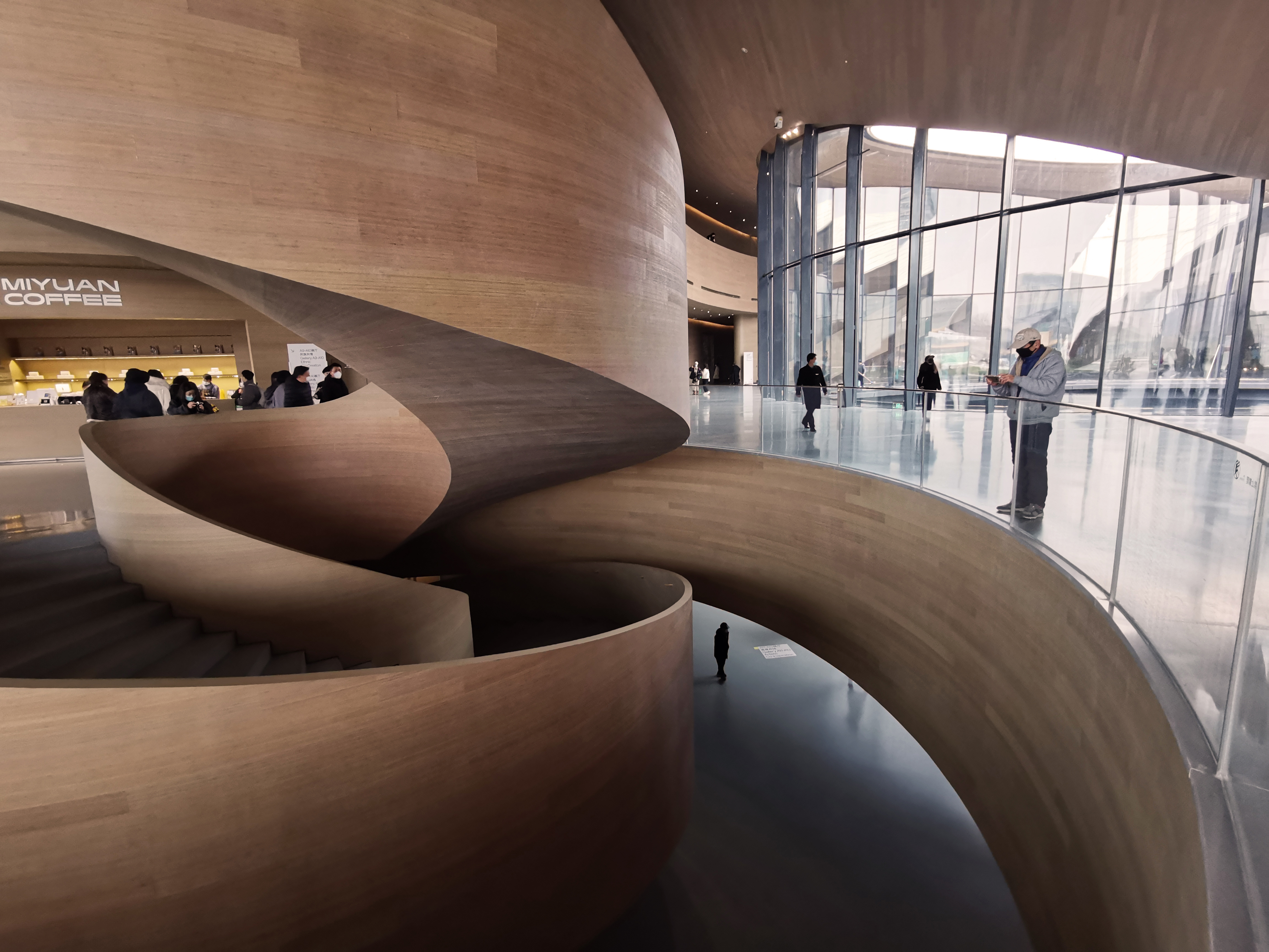 water-inspired architecture, riverfront buildings, urban design, modern Chinese architecture, tranquil environments, architectural aesthetics, public spaces, innovative structures, landscape and architecture, iconic projects