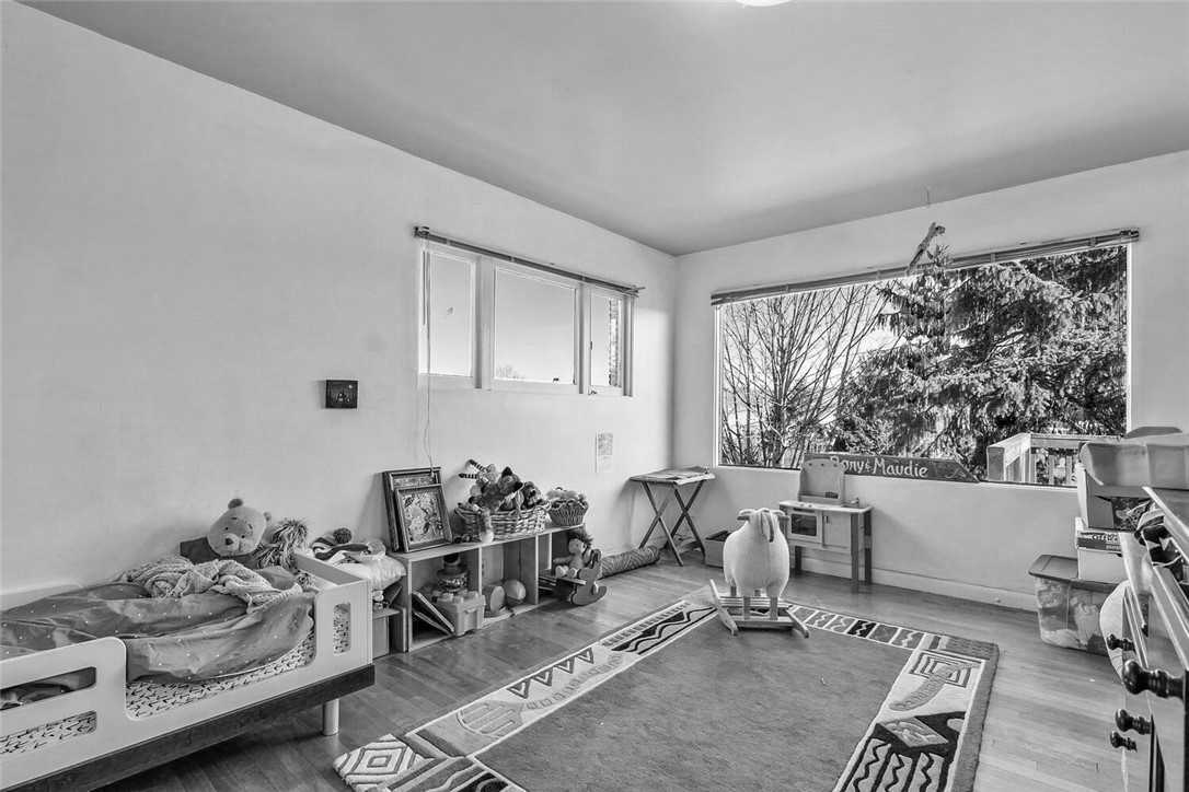 Before - a bedroom with a picture window.