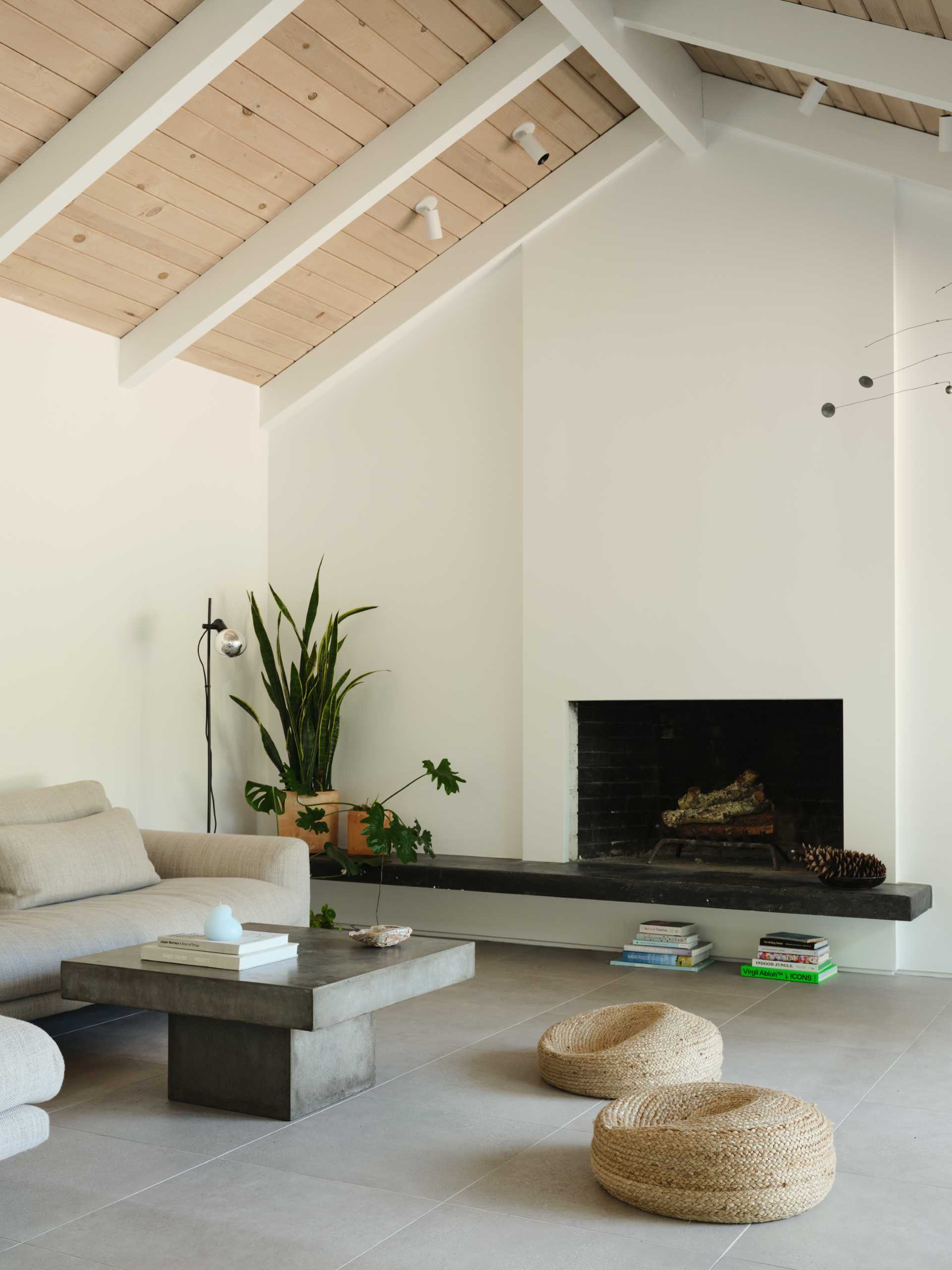 A renovated living room with a fireplace.