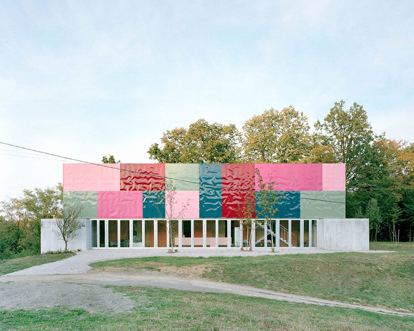 colorful aluminum panels ripple across TEN's house for women in bosnia-herzegovina