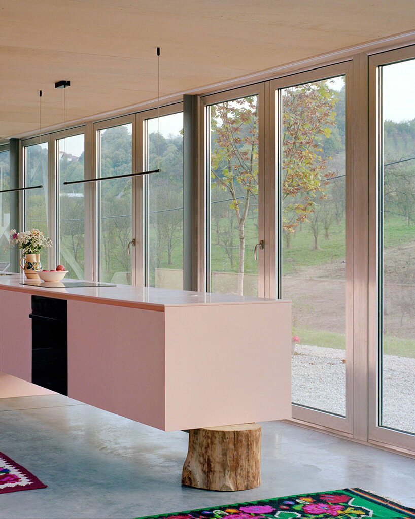 colorful aluminum panels ripple across TEN's house for women in bosnia-herzegovina