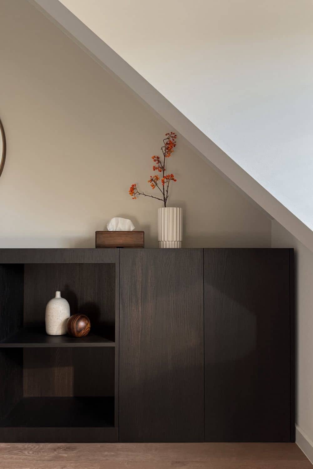 Finished IKEA METOD cabinet hack transformed into a modern wood storage console with hidden storage and open shelves, styled in a bedroom.