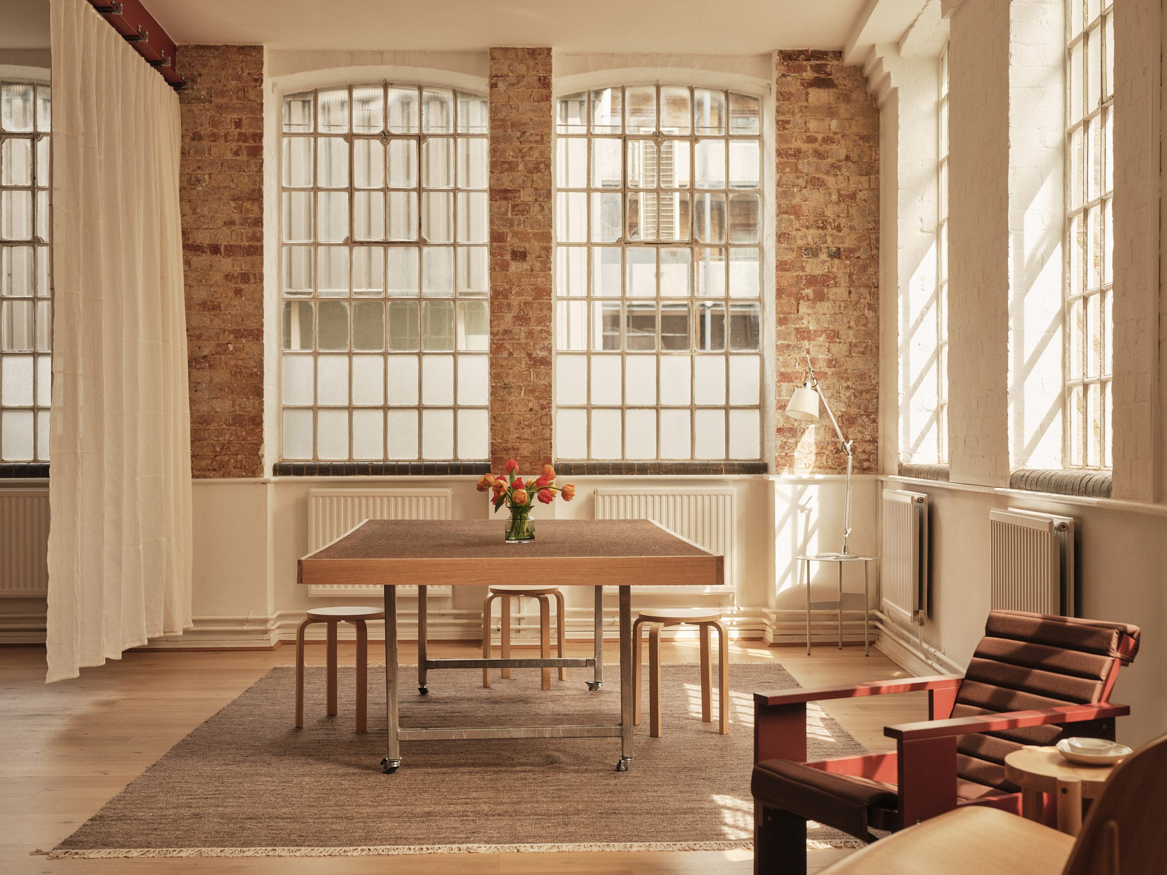 Neutral workspace with large factory windows