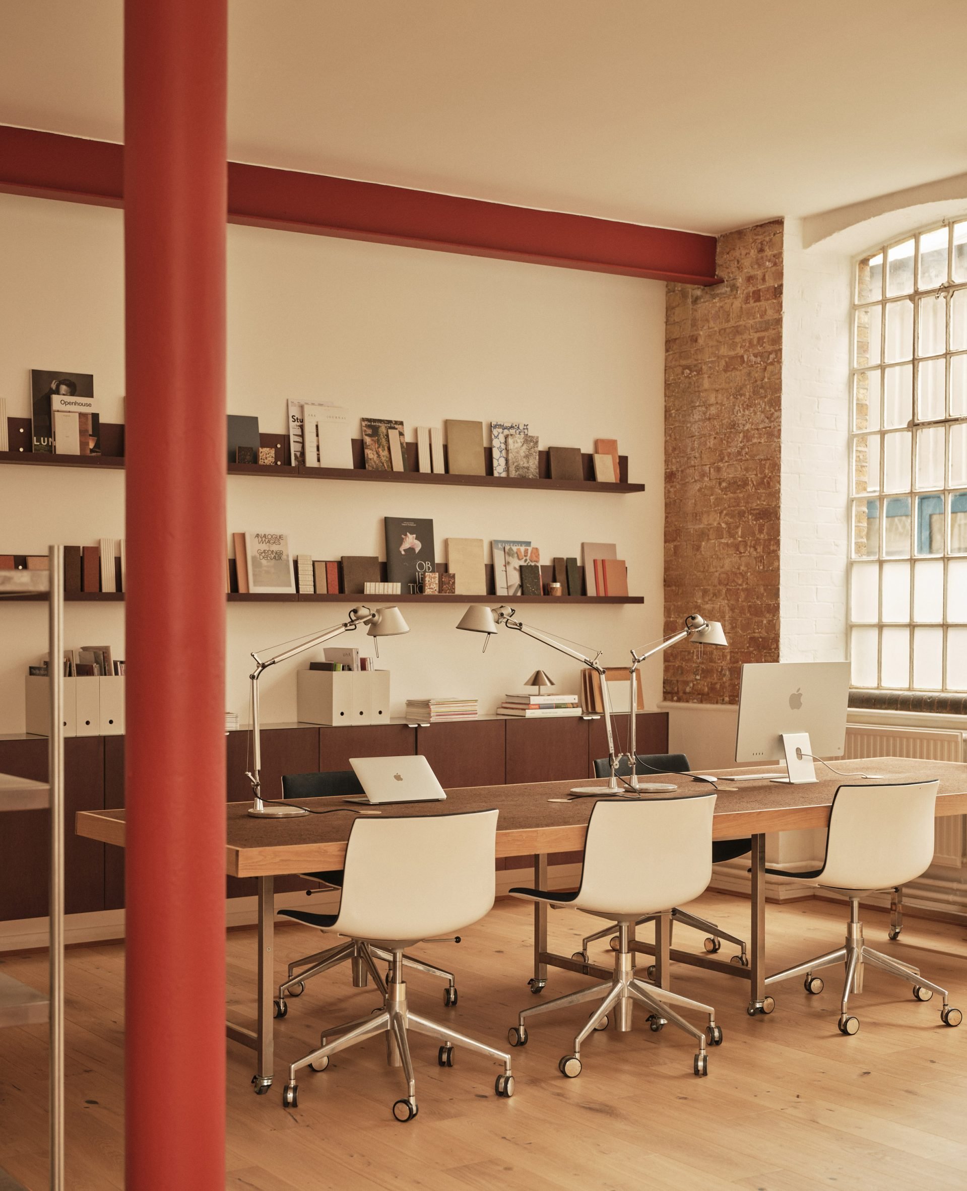 Neutral workspace with large factory windows