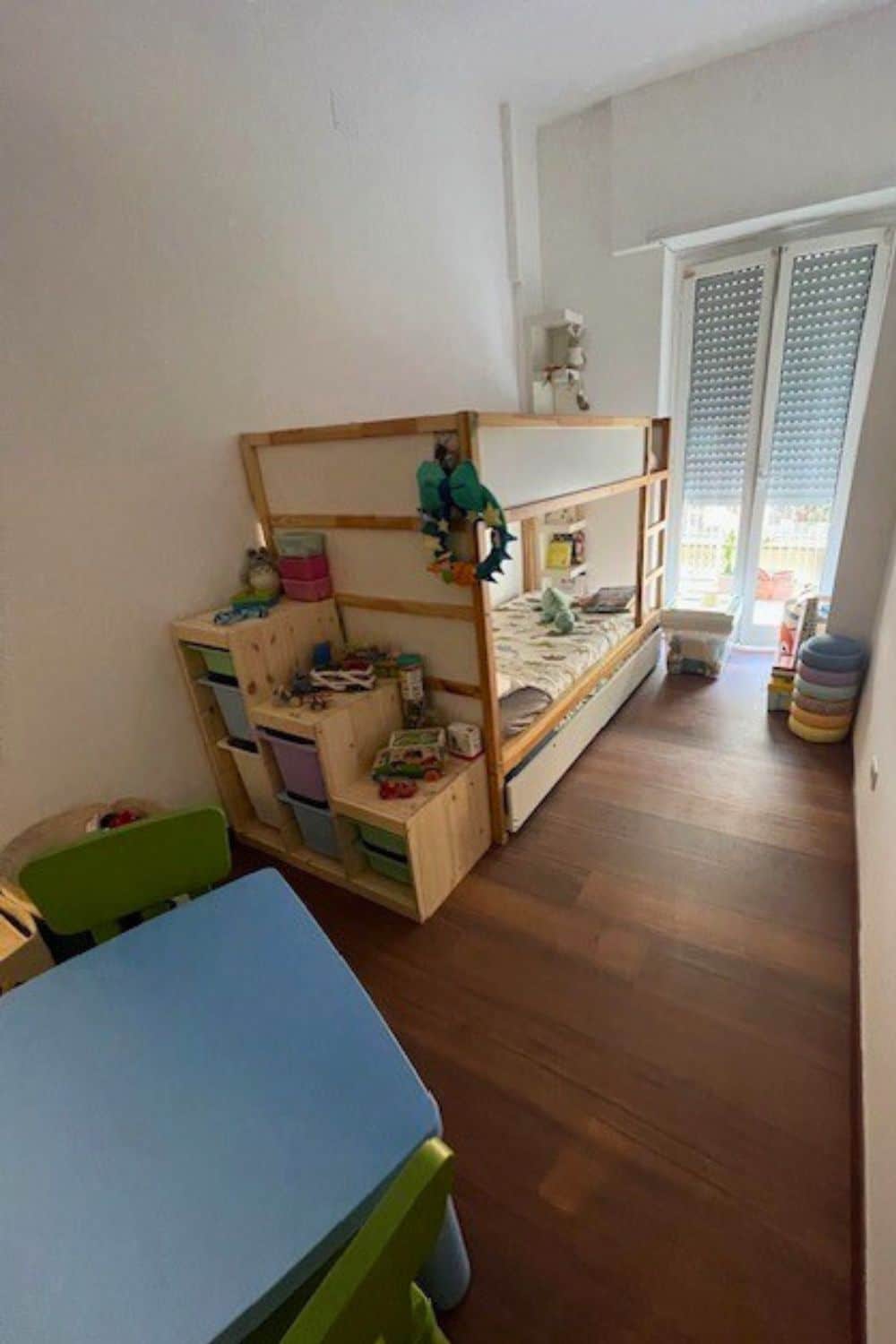 IKEA KURA reversible bed hacked into a triple bunk bed with a pull out trundle