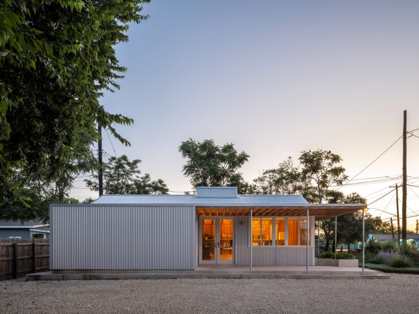 Exterior of a single-storey, metal-clad building at dusk