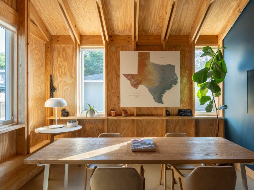 Meeting room with timber walls and wooden furniture