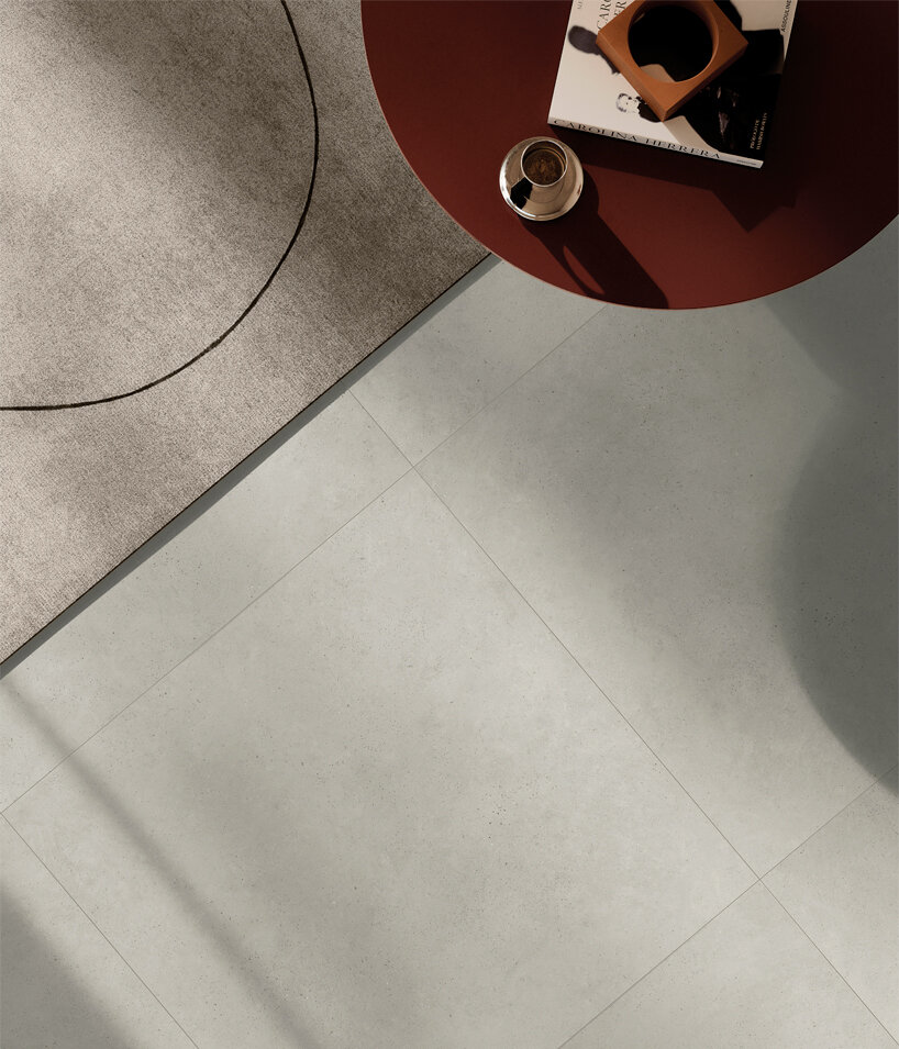 ariostea’s mūra surfaces translate concrete into a unified porcelain stoneware system
