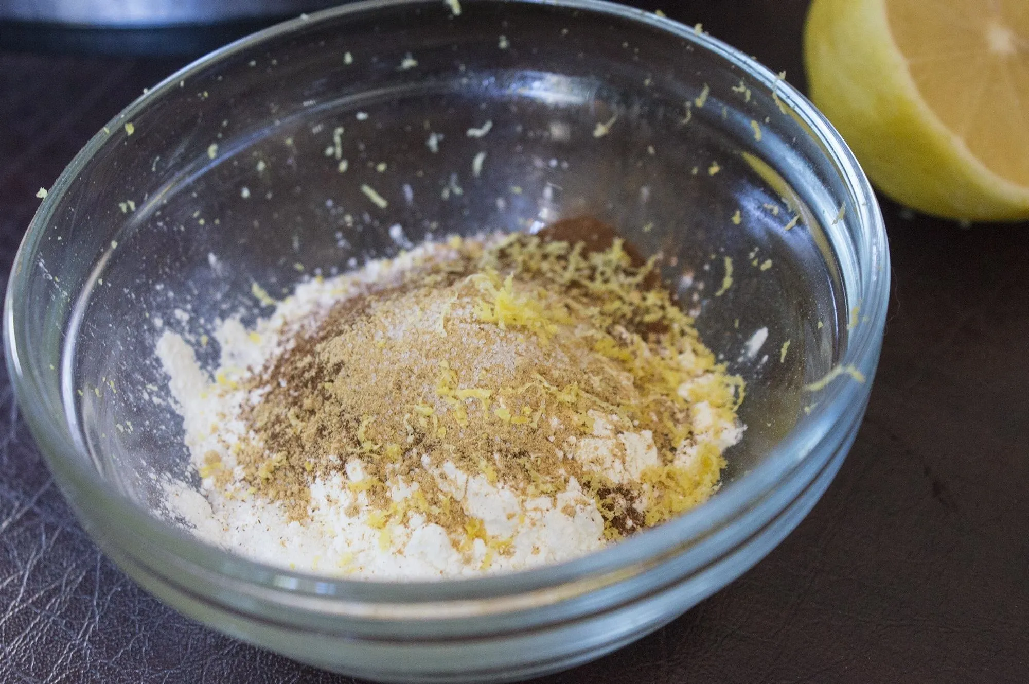 Bowl of mixed spices and lemon zest.