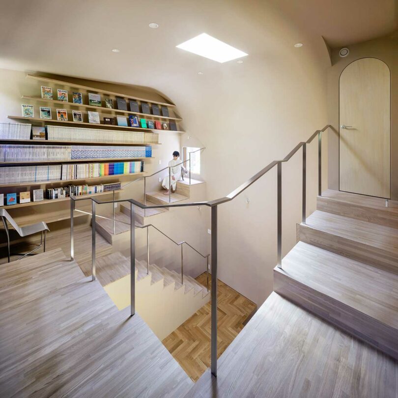 down corner view looking into modern home with stairs lining the perimeter