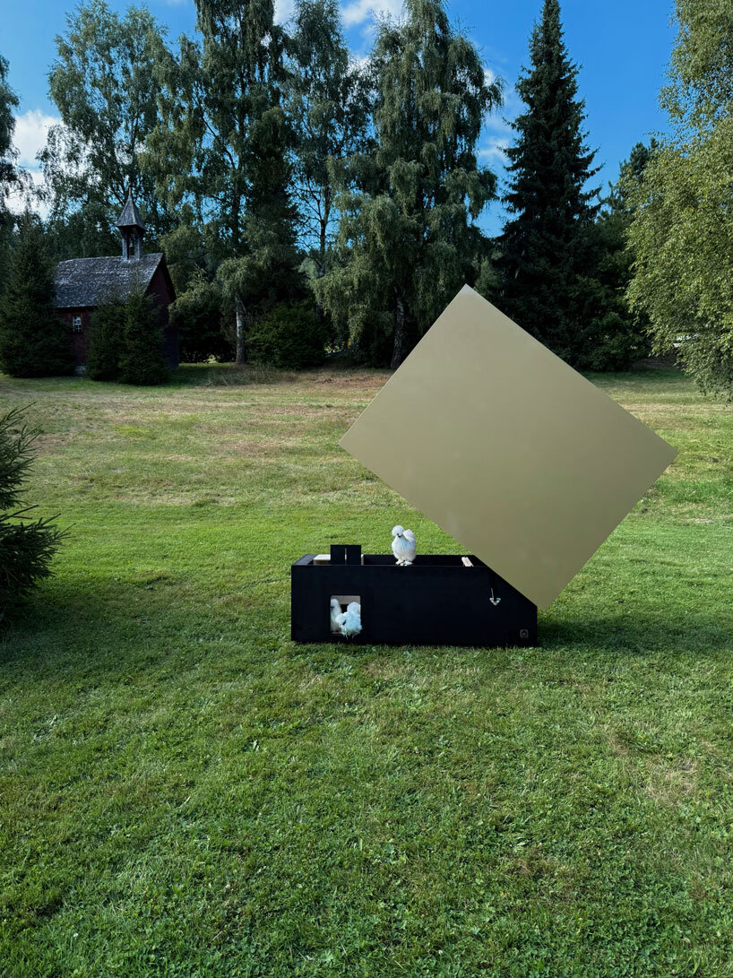 reflective gold facade wraps minimal geometric chicken coop for six fowls