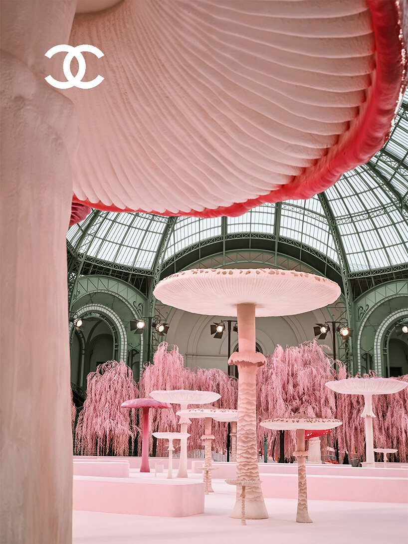 giant mushrooms populate dreamlike forest set inside the grand palais for chanel show