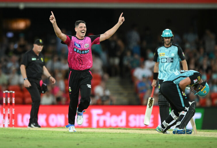 Ben Dwarshuis celebrates the wicket of Michael Neser.