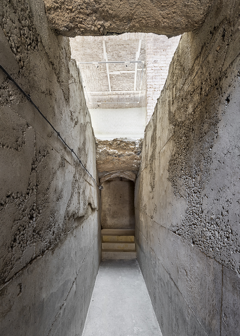 sculptural steel staircase and wall breathes new life into iranian poet’s 1970s home