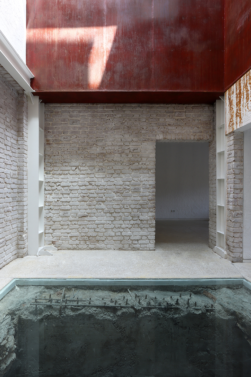 sculptural steel staircase and wall breathes new life into iranian poet’s 1970s home