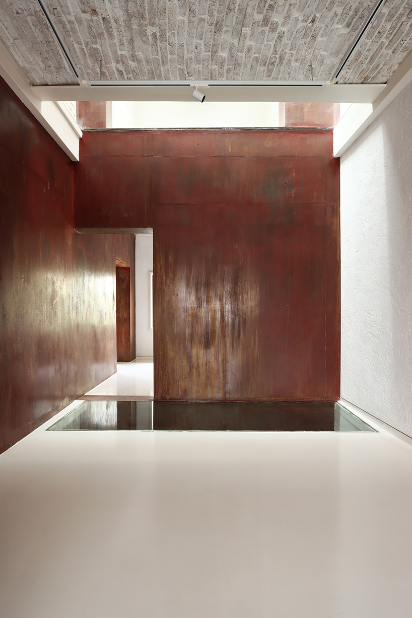 sculptural steel staircase and wall breathes new life into iranian poet’s 1970s home