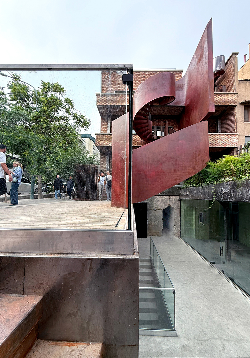 sculptural steel staircase and wall breathes new life into iranian poet’s 1970s home
